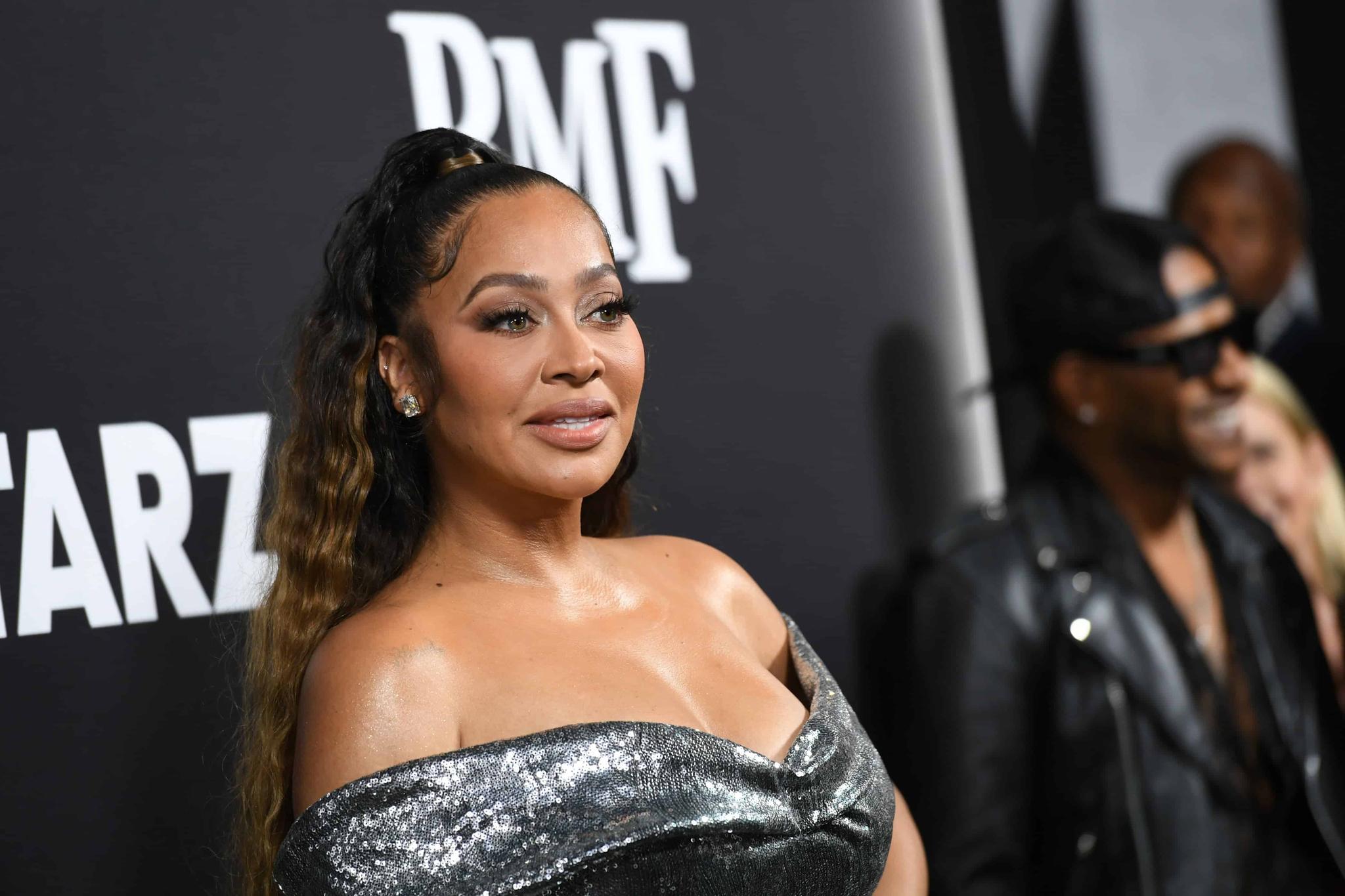 LaLa Anthony Switches Up Her Look, Poses With Long Strawberry Blonde Hair In Sexy Two-Piece Outfit